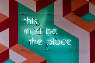 Neon sign spelling: this must be the place