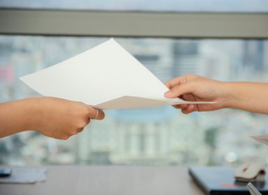 Paper contract exchange between two hands